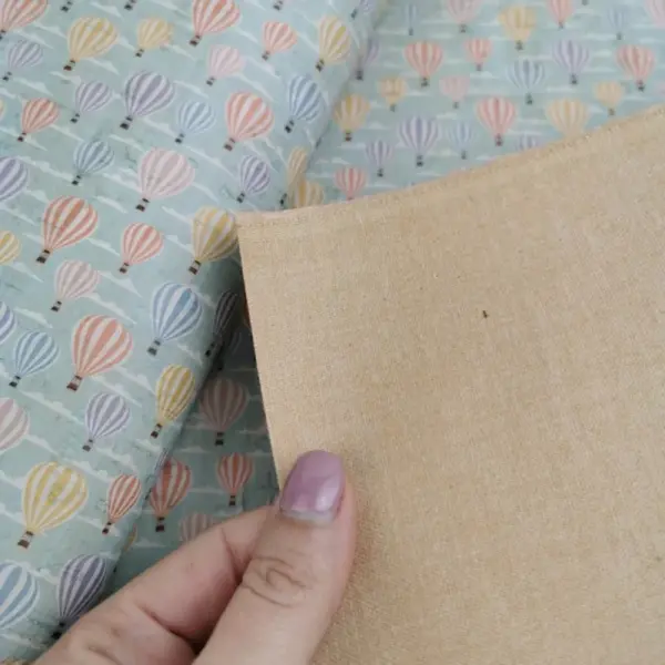 This is a balloons printed pattern on cork fabric