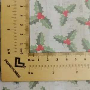This is a holly printed pattern on cork fabric