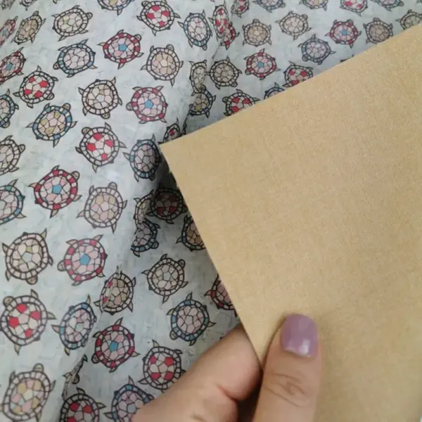 This is a turtles printed pattern on cork fabric
