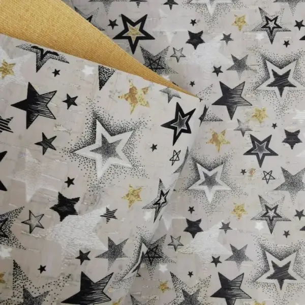 This is a stars printed pattern on cork fabric