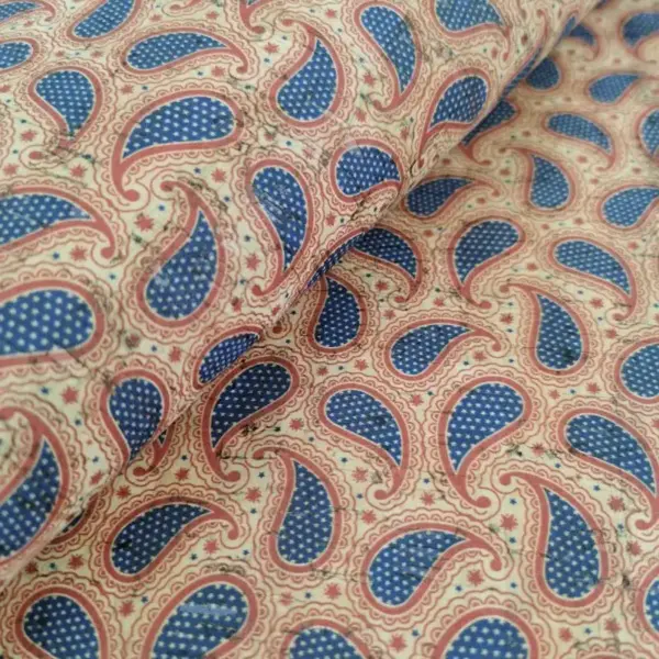 This is a paisley printed pattern on cork fabric