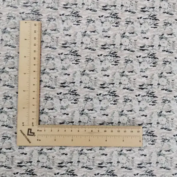 This is a camouflage printed pattern on cork fabric