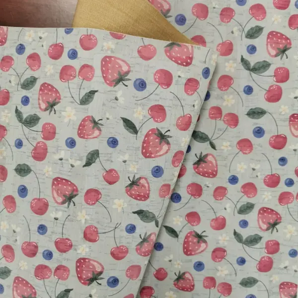 This is a berries printed pattern on cork fabric
