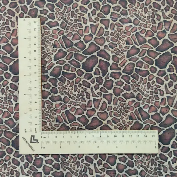 This is a giraffe printed pattern on cork fabric