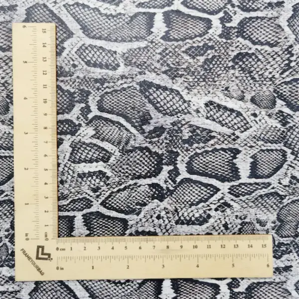 This is a snake printed pattern on cork fabric