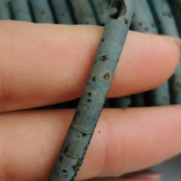 This is a 5mm petroleum blue superior round cork cord