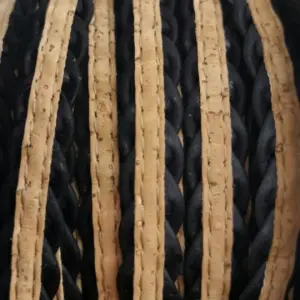 This is a 10mm black superior braided flat cork cord with natural