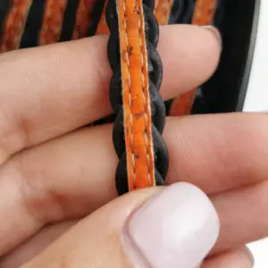 This is a 10mm black superior braided flat cork cord with orange