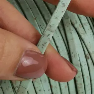 This is a 5mm green aqua superior flat cork cord