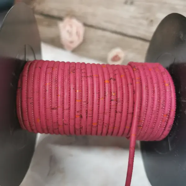 This is a 3mm fuchsia rustic round cork cord