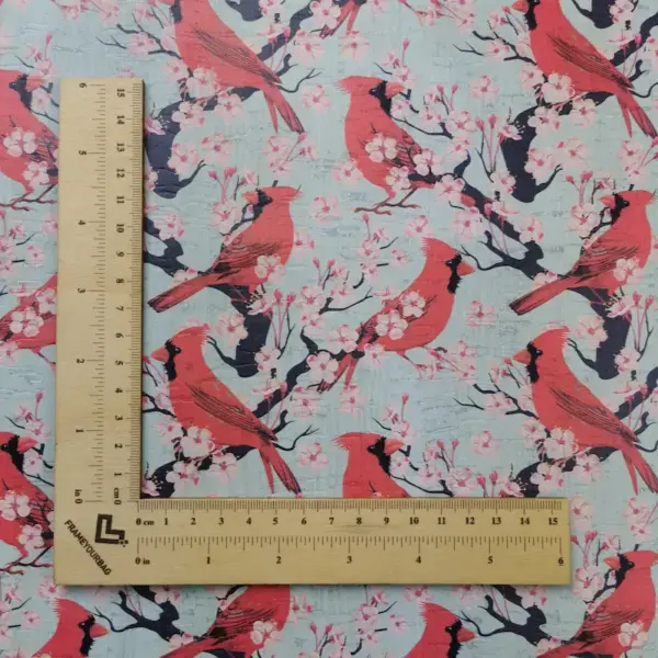 This is a birds printed pattern on white rustic cork fabric