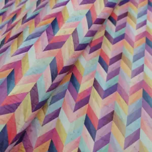 This is a chevron printed pattern on white rustic cork fabric