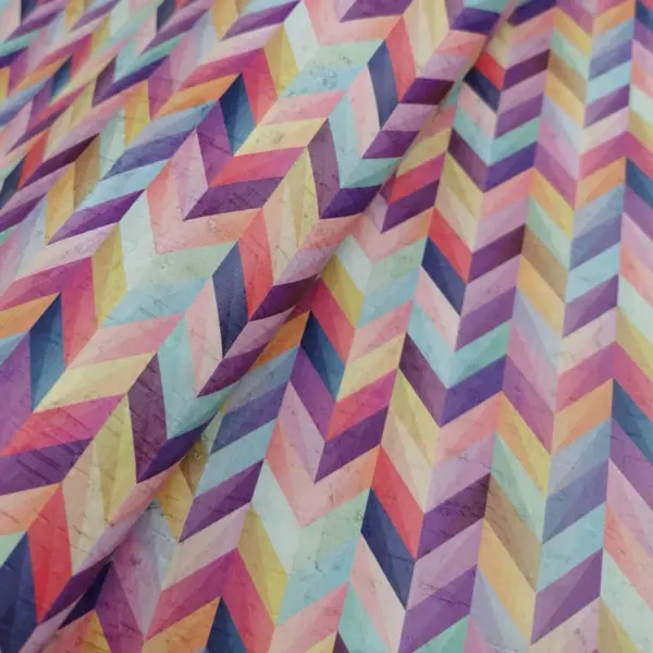 This is a chevron printed pattern on white rustic cork fabric