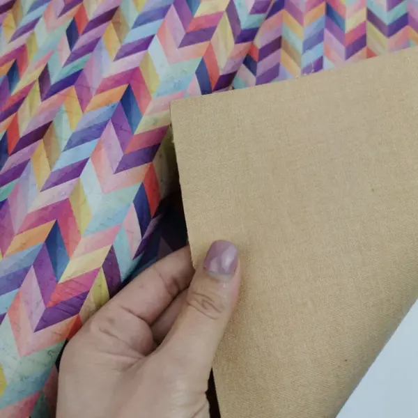 This is a chevron printed pattern on white rustic cork fabric