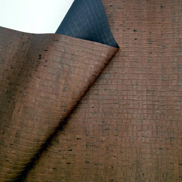 This is a crocodile embossed pattern on brown rustic cork fabric