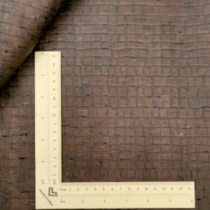 This is a crocodile embossed pattern on brown rustic cork fabric