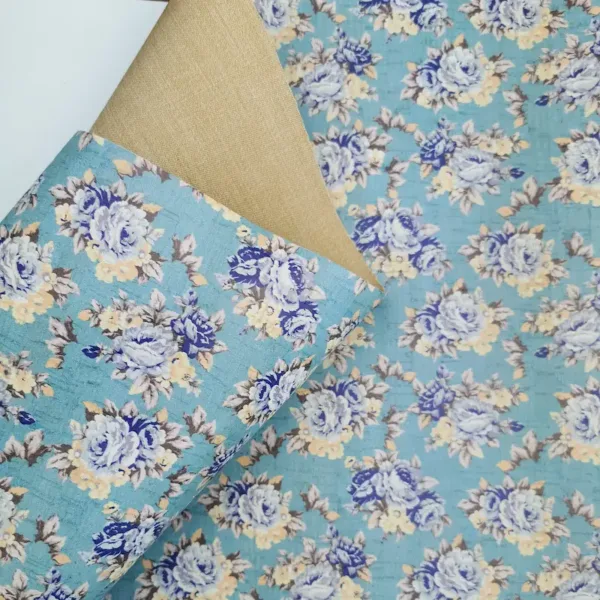 This is a flowers printed pattern on white rustic cork fabric