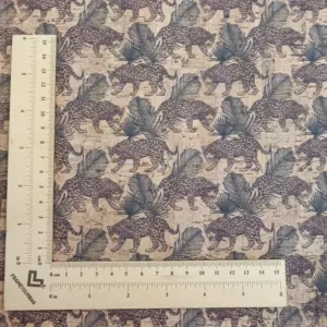 This is a leopard printed pattern on natural rustic cork fabric